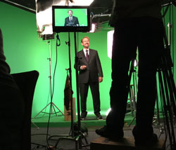 Daniel Burrus behind the camera with green screen behind him