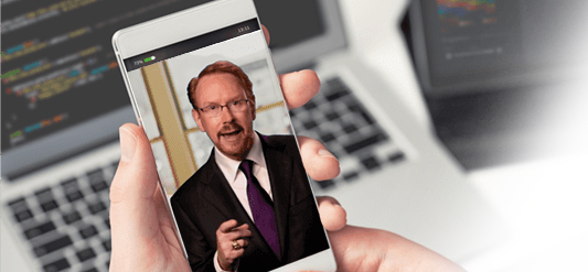 Someone holding a smart phone with Daniel Burrus on video chat.