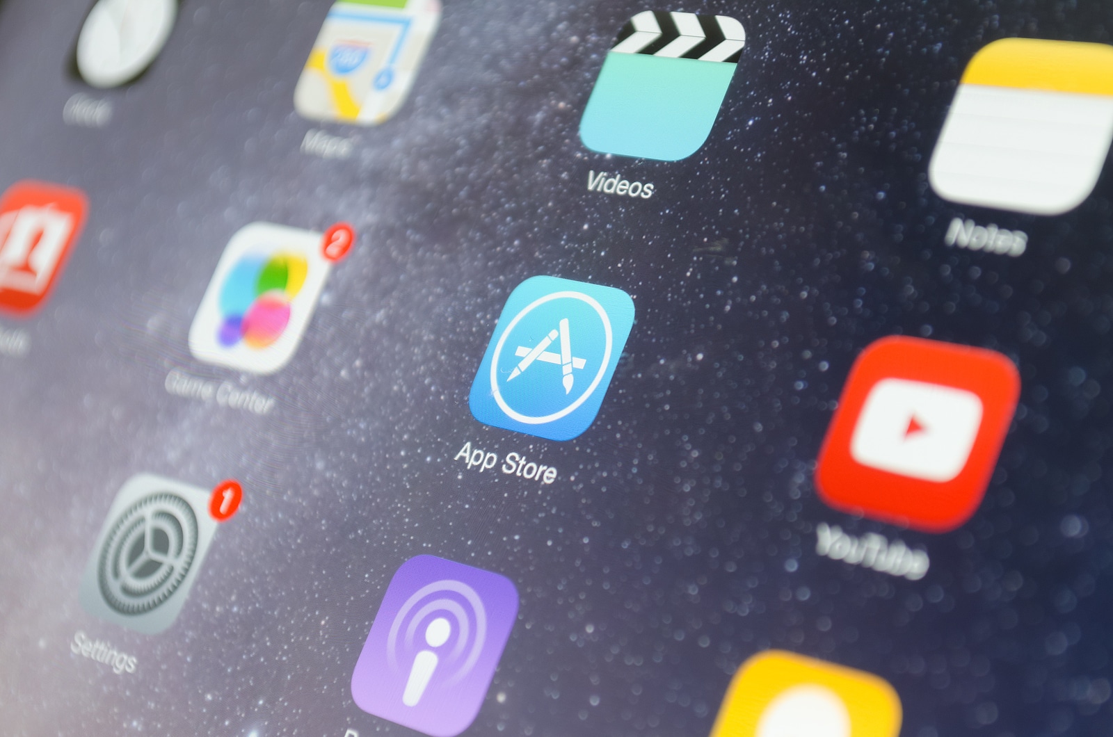 A close-up photo of Apple iPad start screen focused on App Store application icon.